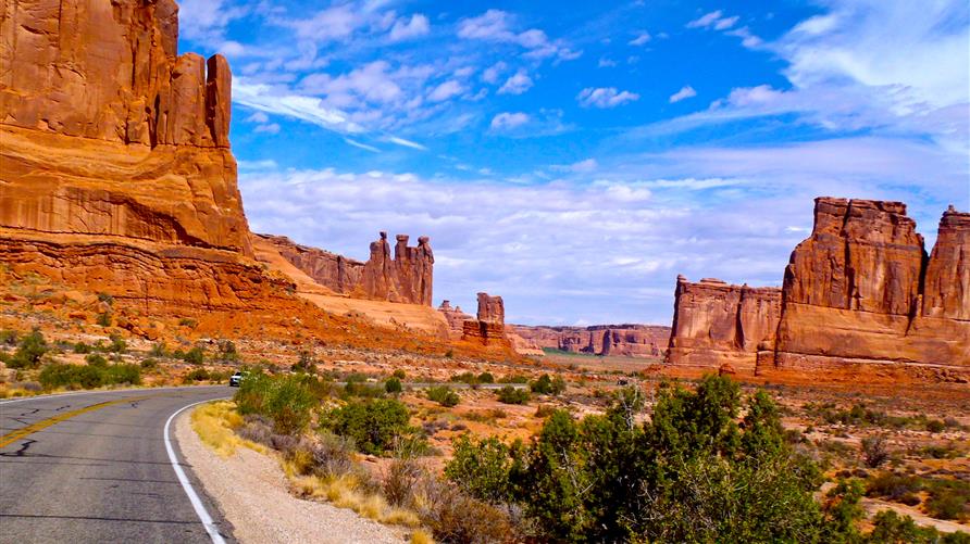 A picture of the open road in Arches National Park, Utah on a Utah National Parks road trip.
