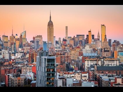 Sunrise over the Manhattan skyline, New York, New York.