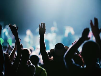 People enjoying an evening concert