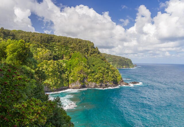Idyllic aerial image of Hana, lush green cliffs, turquiose waters, Maui, Hawaii.