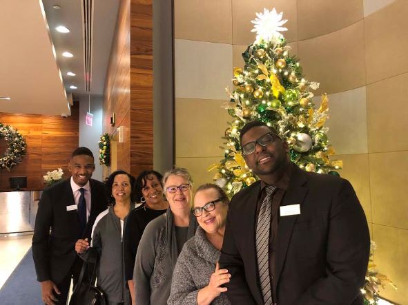 Hilton Grand Vacations Owners posing, Christmas at West 57th Street, New York, New York. 