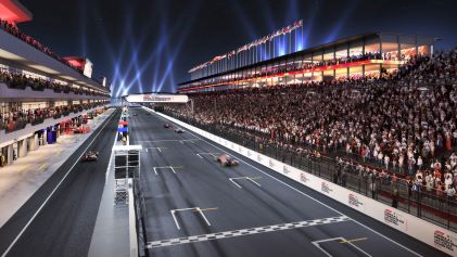 Aerial view, F1® Grand Prix race track, filled stands, spot lights, night sky, Las Vegas, Nevada. 