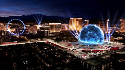 Stunning aerial view, Las Vegas Strip, glowing lights, night sky, F1® race installations, Nevada. 