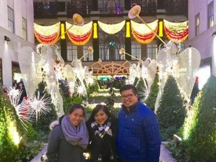 A Hilton Grand Vacations Member and her travel party at Rockefeller Center in New York during the holidays