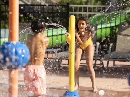 Kids playing at an outdoor water park