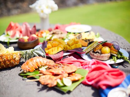 Spread of regional Hawaiian foods in the grill area at Hilton Waikoloa Village on the Big Island of Hawaii. 