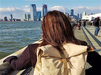 Hilton Grand Vacations Owner admiring the New York Harbor from The Battery in New York City. 