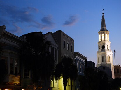 White church steeple illuminated in the night sky, Charleston, South Carolina. 
