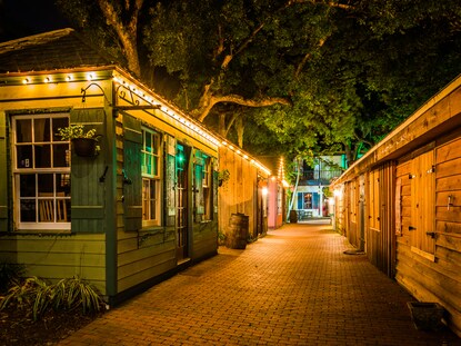 Alley way lighting the night sky in St. Augustine, Florida. 